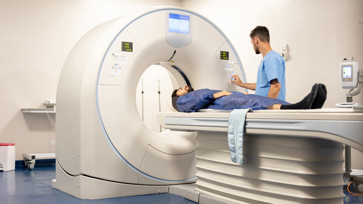 A Guy Getting A CT Scan at a Hospital