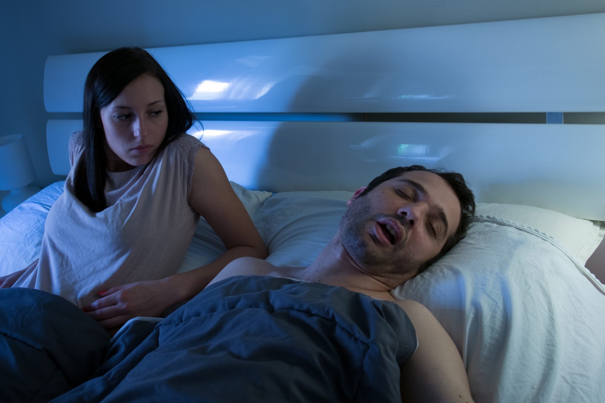 Woman worried and sleepless because his man is snoring loudly